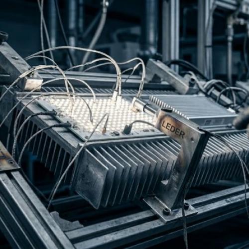 How do commercial LED manufacturers control junction temperature during burn-in testing?